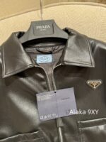 Prada 24 AutumnWinter New Collection  Environmentally friendly protein leather fabric triangle logo nylon lapel jacket top, short skirt set, feminine slimming - Image 4