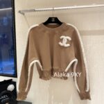 chanel   24k AutumnWinter New Collection  Wool Lamb Splicing and Velvet Round Neck Brown Hoodie for Women. Warm, fashionable, and super easy to wear