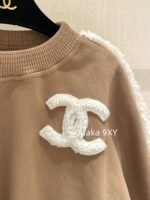 chanel   24k AutumnWinter New Collection  Wool Lamb Splicing and Velvet Round Neck Brown Hoodie for Women. Warm, fashionable, and super easy to wear - Image 21