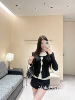 CHANEL   Korean atmosphere girl group outfit2024SS early autumn new collection fake twopiece stacked rhinestone logo round neck knitted long sleeved top for women