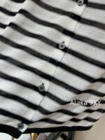 Yves Saint Laurent Early Autumn Collection   Bead round neck letter logo black and white color blocked striped knitted sweater for women - Image 14