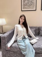 Chanel high version  24A Fashion Collection  A musthave item for white, wealthy and beautiful socialites, with a highend feel. The puffy flower bud sleeves are hollowed out, embroidered with rhinestone buckles, sun resistant, knitted cardigans, and women's hoodies - Image 3