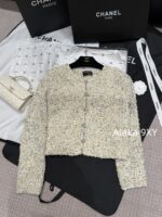 chanel   2024k Early Autumn New Collection  Women's crochet lemon yellow sand thread rhinestone buckle hollow long sleeved knitted cardigan jacket. Mini Short - Image 21