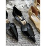 Chanel's own collection  the most beautiful pair of pointed single shoes in 23k. Three dimensional resin camellias embellish the small slope and design, showcasing the leg lengthening artifact