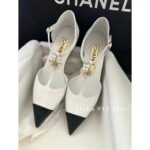 Chanel's own collection  the most beautiful pair of pointed single shoes in 23k. Three dimensional resin camellias embellish the small slope and design, showcasing the leg lengthening artifact - Image 9