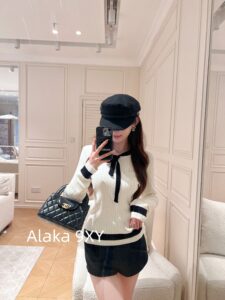The heiress of the Chanel conglomerate ”  New collection for autumn and winter season 24: Black and white color matching elegant temperament lace up bow pullover wool sweater. - Image 5