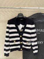 BALMAIN2024ss Early Autumn New Collection  High Version Classic Black and White Striped Metal Buckle VNeck Padded Shoulder Knitted Cardigan Coat for Women. - Image 4