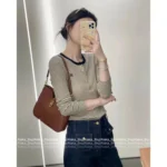 Celine 2025SS Early Fall Collection 🔍 Black & White Contrast Knit Top - Slim-Fit Round Neck w/ Metal Logo Buttons - Image 9